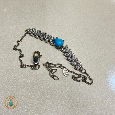 دستبند نقره زنانه تمام نگین طرح جواهری با سنگ فیروزه در وسط | کد ۲۴۲